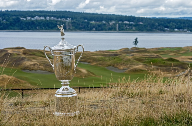 A US Open Championship trophy is displayed after a news conference at Chambers Bay Golf Course in University Place, Wash., Friday, June 27, 2014. The golf course will host the US Open Championship golf tournament in 2015. (AP Photo/The News Tribune, Peter Haley)