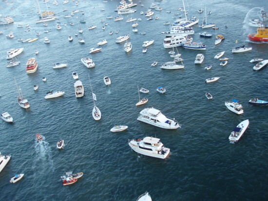 a mass of boats sailing in different directions