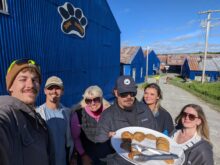 Group selfie with plate of baked goods